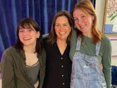 LeeAnn Kreischer with her two daughters on her podcast.